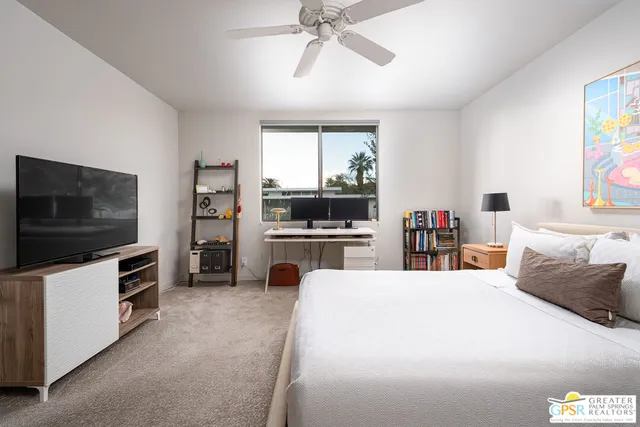 a front view of a house with a garden and plants