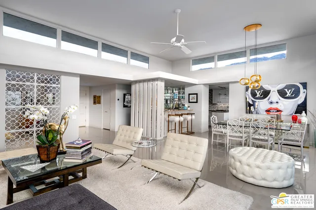 a front view of a house with a potted plant