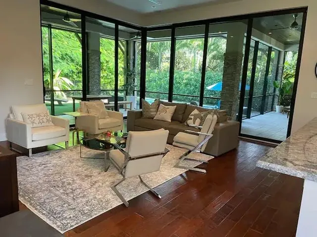 a living room with furniture and a large window