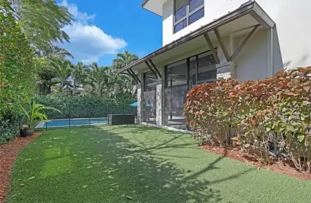 a backyard of a house with lots of green space