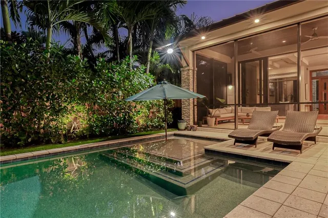 a view of a swimming pool with a patio