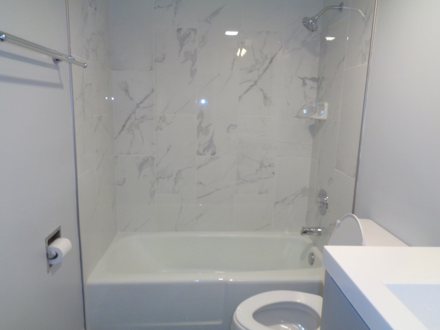 4010 150th Street, Unit 6 Midlothian, IL 60445 - Photo 10 of 13 a bathroom with a shower a bathtub and a toilet