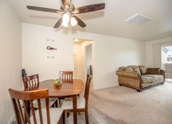 a living room with furniture and a table
