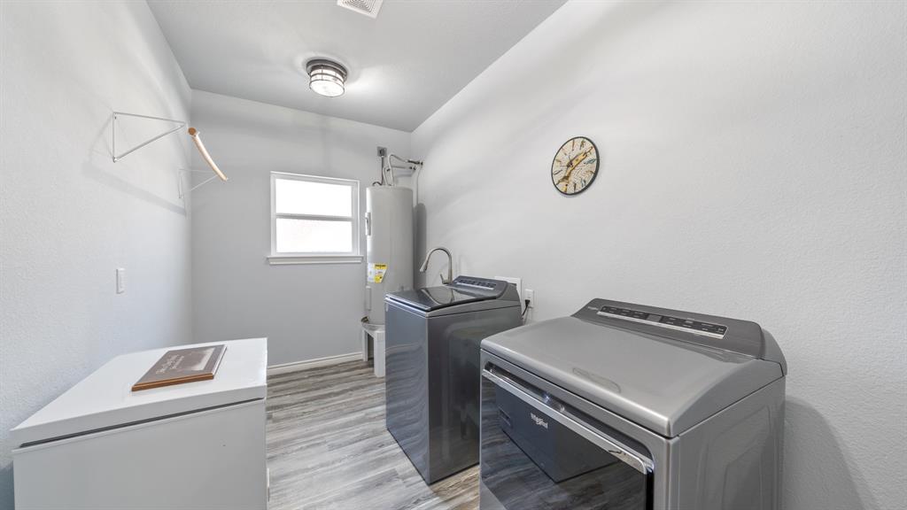 151 Sun Down Trail Mabank, TX 75156 - Photo 13 of 29 a utility room with dryer and washer