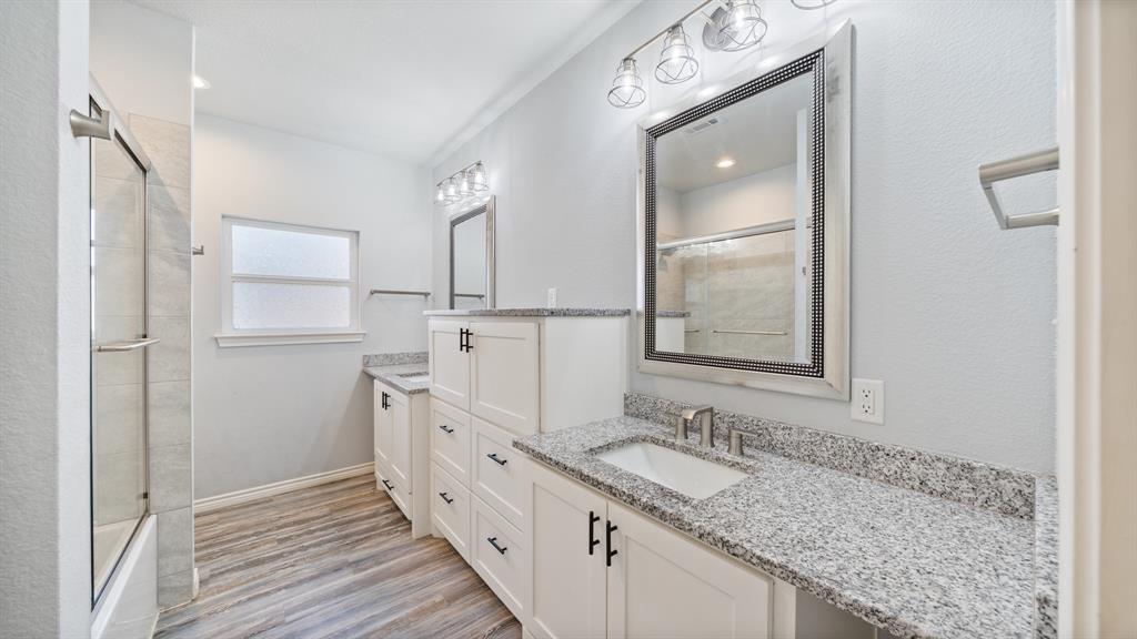 151 Sun Down Trail Mabank, TX 75156 - Photo 14 of 29 a bathroom with a granite countertop sink mirror and double