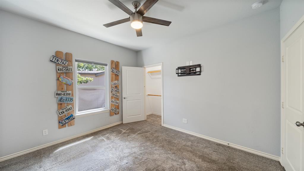 151 Sun Down Trail Mabank, TX 75156 - Photo 15 of 29 an empty room with windows and ceiling fan