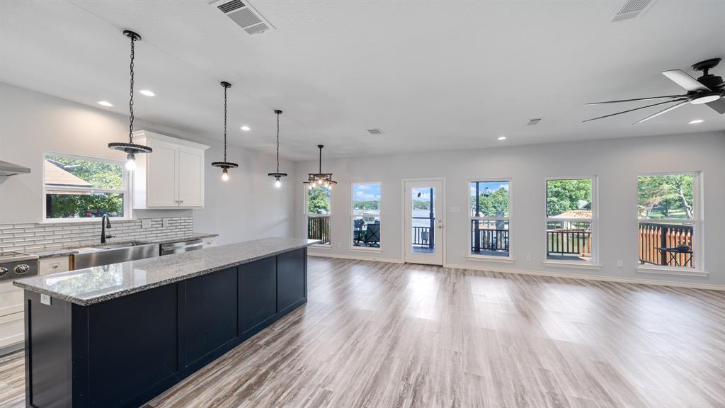 151 Sun Down Trail Mabank, TX 75156 - Photo 26 of 29 a large kitchen with lots of counter space and wooden floor