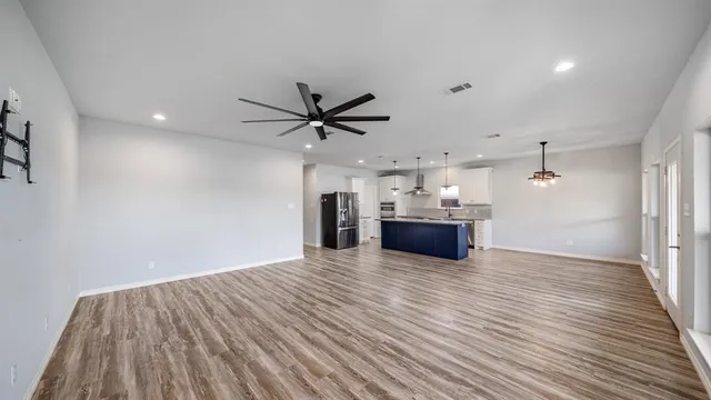 a view of a lake with boats and trees in the background