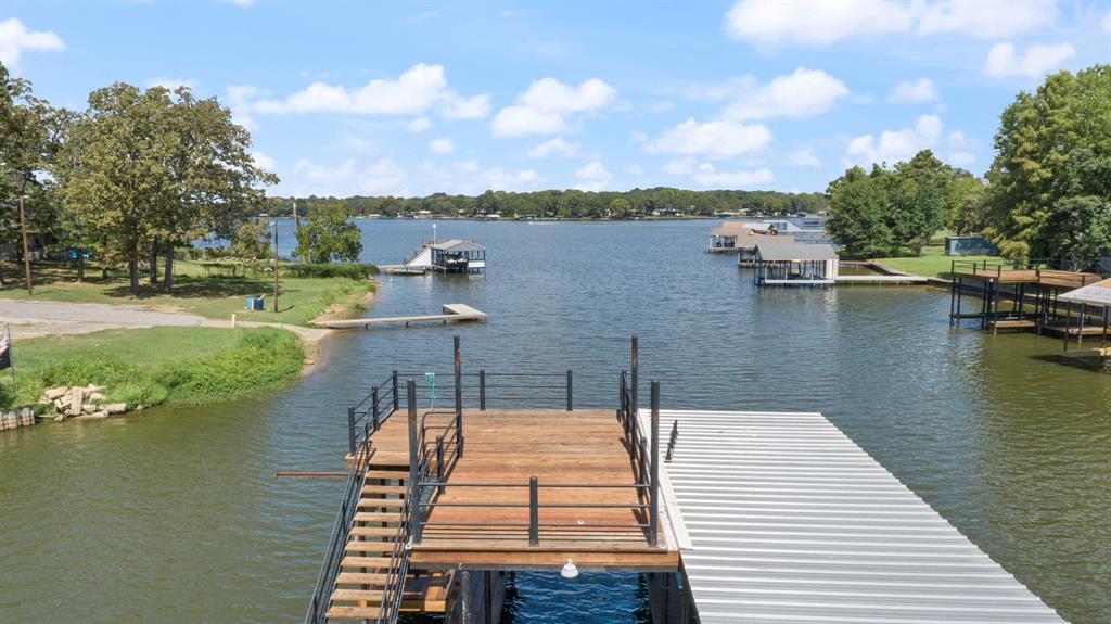 151 Sun Down Trail Mabank, TX 75156 - Photo 24 of 29 a view of a lake with boats and trees in the background
