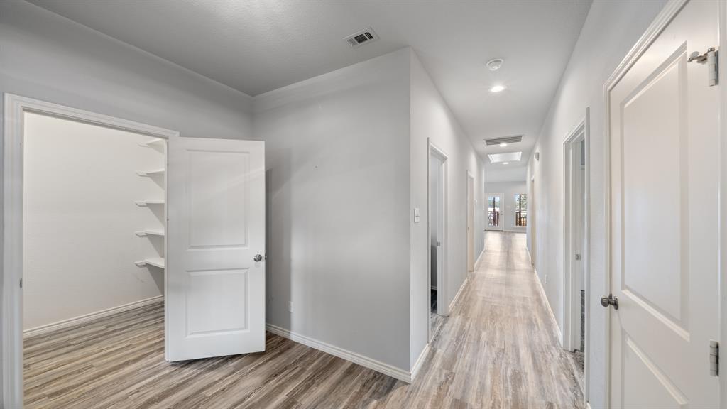 151 Sun Down Trail Mabank, TX 75156 - Photo 6 of 29 a view of a hallway with wooden floor
