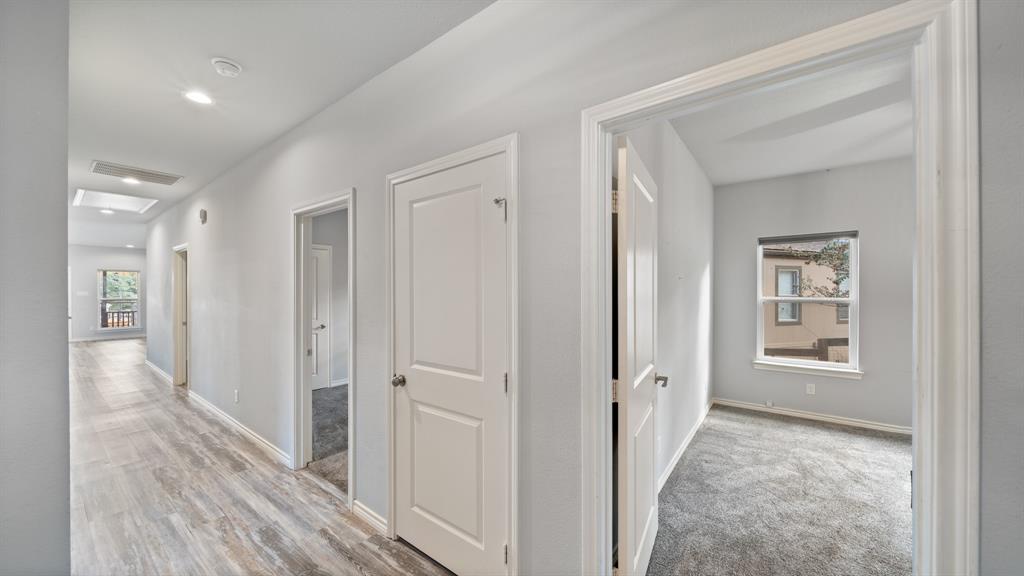 151 Sun Down Trail Mabank, TX 75156 - Photo 7 of 29 a view of a hallway with wooden floor and closet
