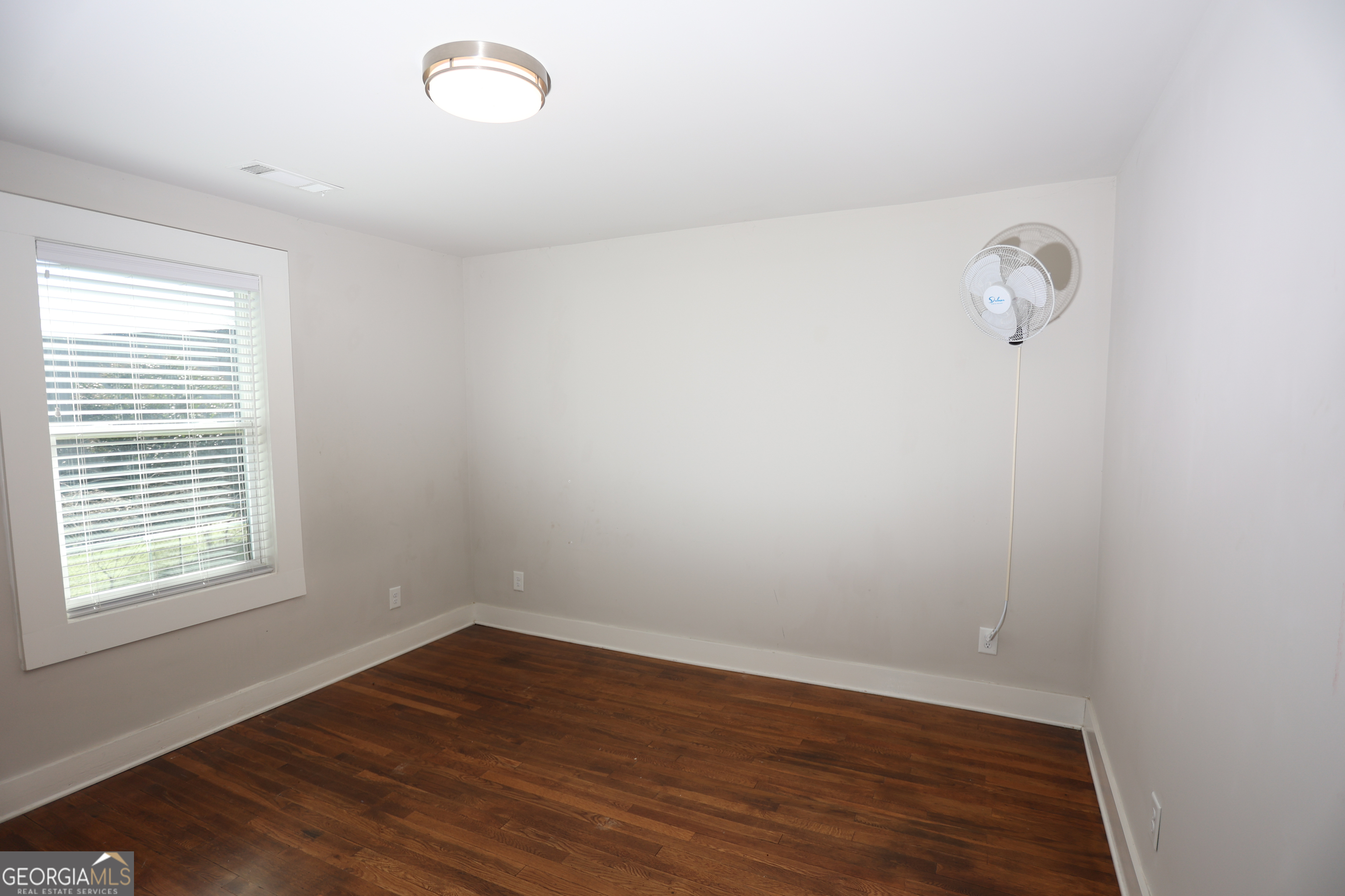 68 Hayes Street Toccoa, GA 30577 - Photo 11 of 33 wooden floor in an empty room