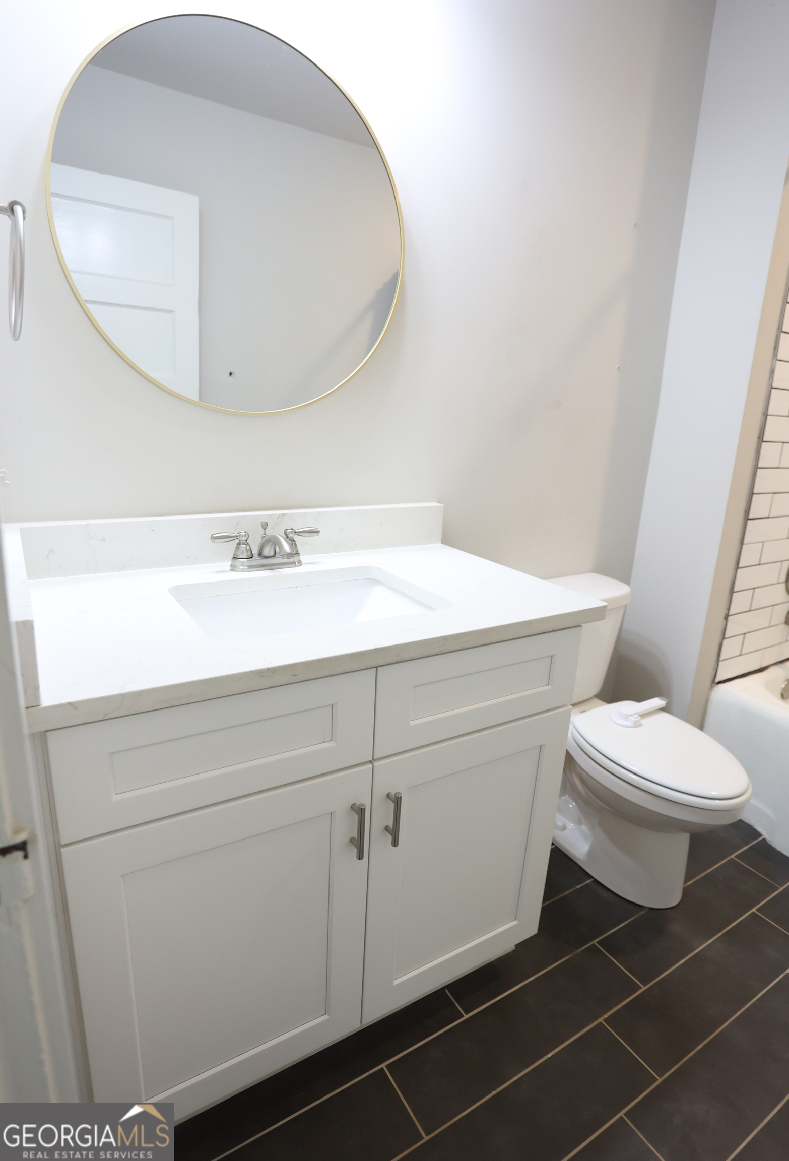 68 Hayes Street Toccoa, GA 30577 - Photo 15 of 33 a bathroom with a toilet and a mirror