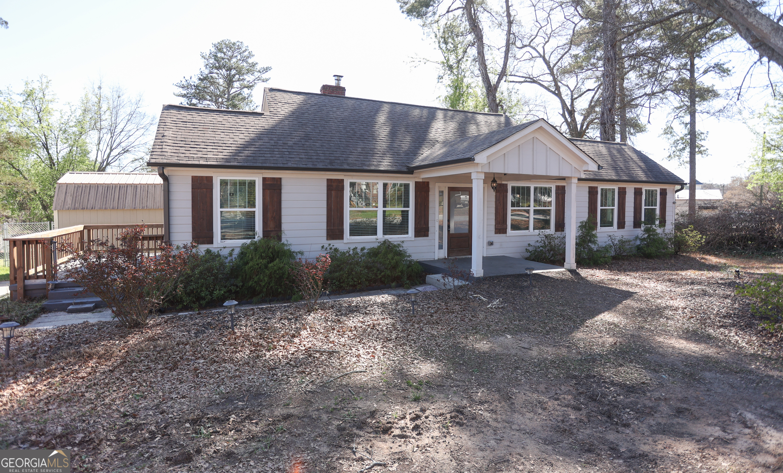 68 Hayes Street Toccoa, GA 30577 - Photo 2 of 33 a front view of a house with a yard and trees