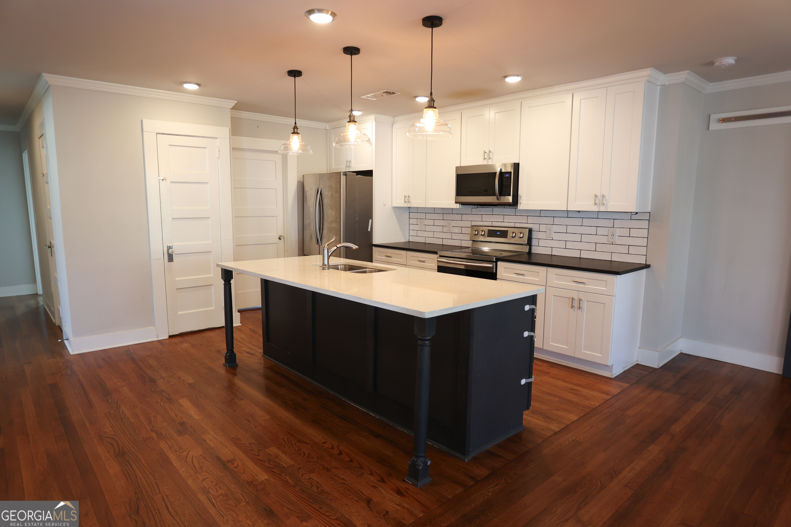 68 Hayes Street Toccoa, GA 30577 - Photo 26 of 33 a kitchen with wooden cabinets and sink