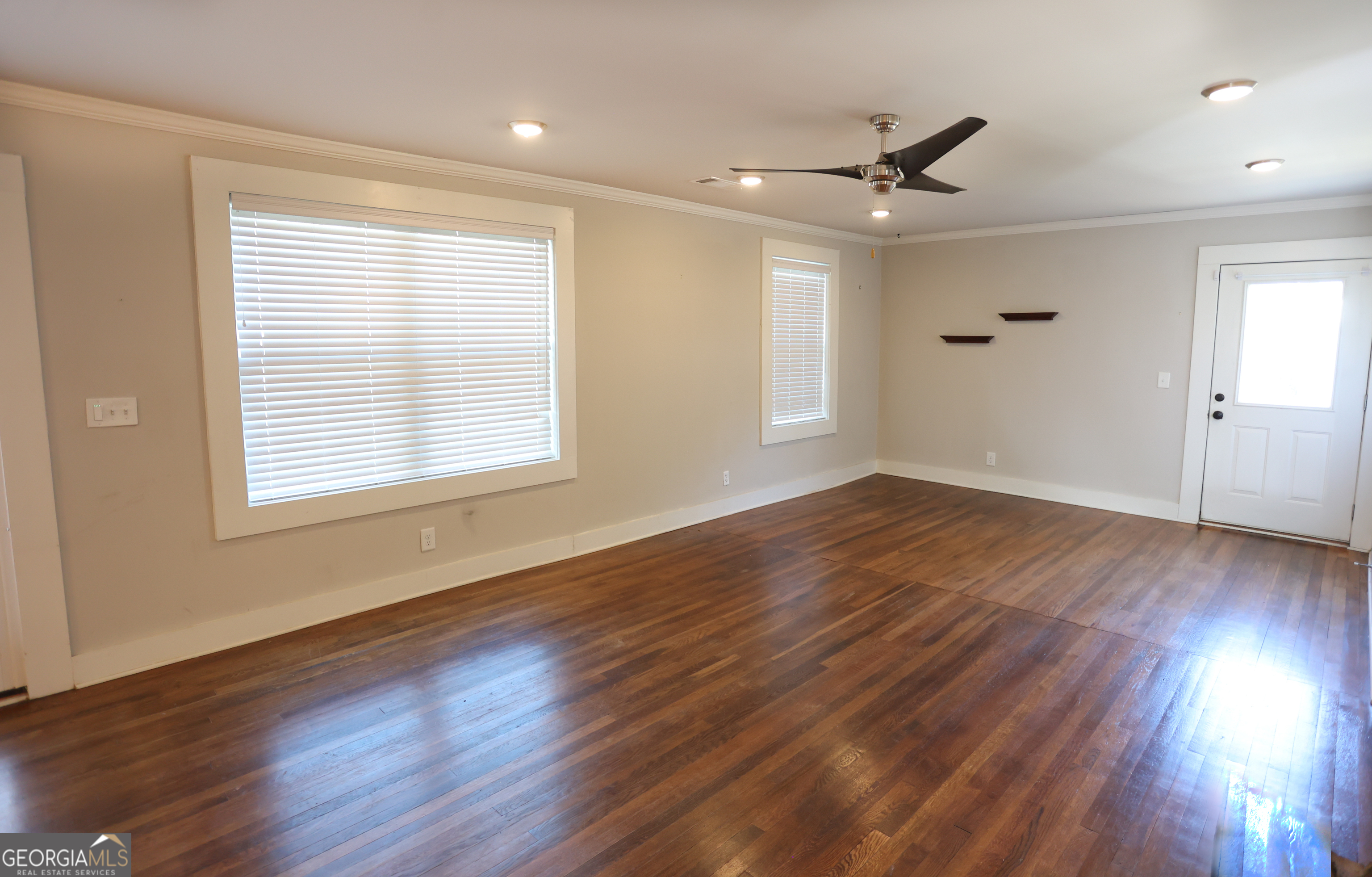 68 Hayes Street Toccoa, GA 30577 - Photo 31 of 33 a view of an empty room with wooden floor and a window