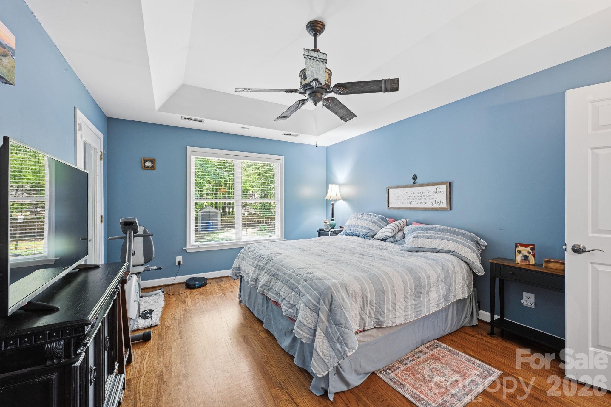 145 Upper Spencer Mountain Road Stanley, NC 28164 - Photo 20 of 29 a bedroom with a bed and a flat tv screen