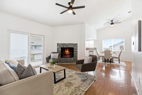 a living room with furniture and a fireplace