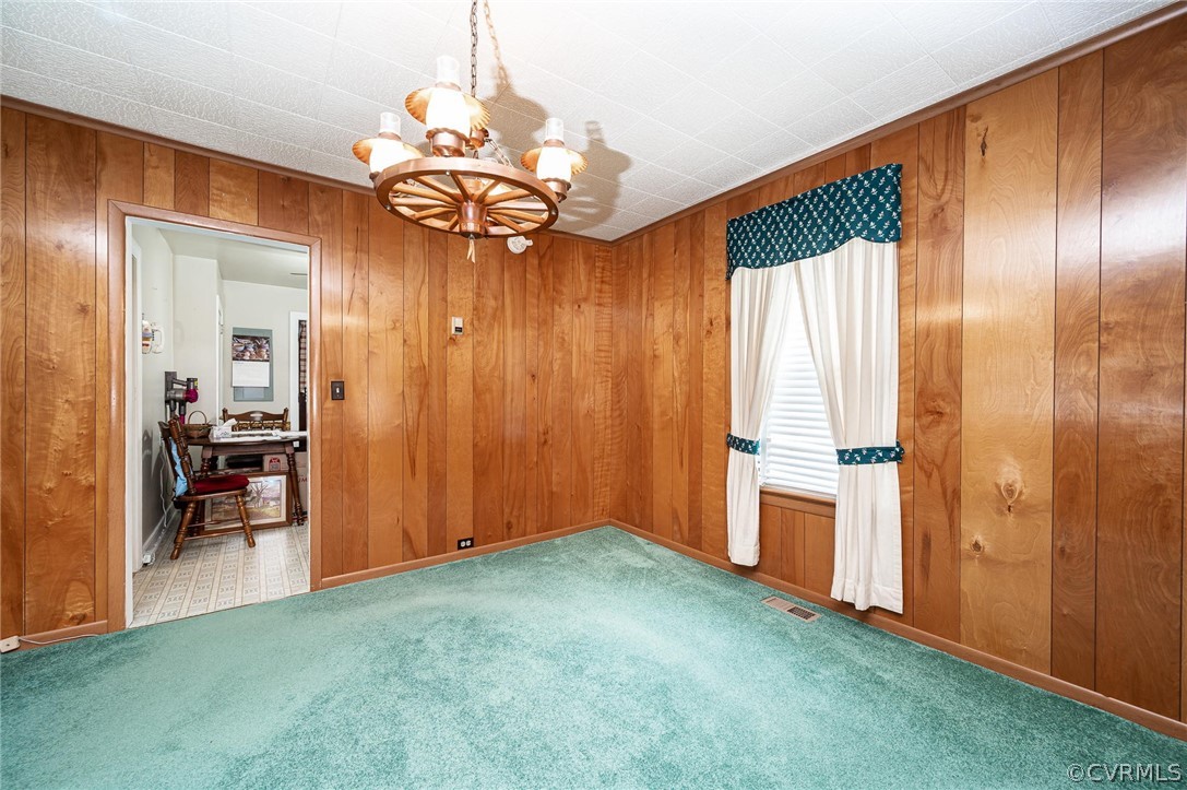 9401 Reams Road Chesterfield, VA 23236 - Photo 8 of 27 a view of a livingroom with a chandelier fan and a livingroom