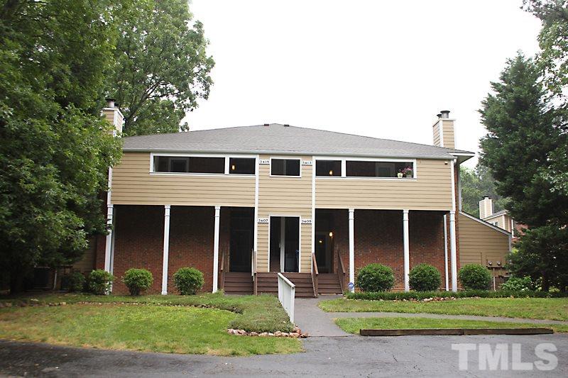 3405 Mill Run Raleigh, NC 27612 - Photo 1 of 12 a front view of a house with a yard