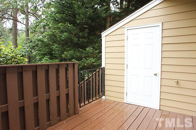 3405 Mill Run Raleigh, NC 27612 - Photo 11 of 12 a view of a wooden fence