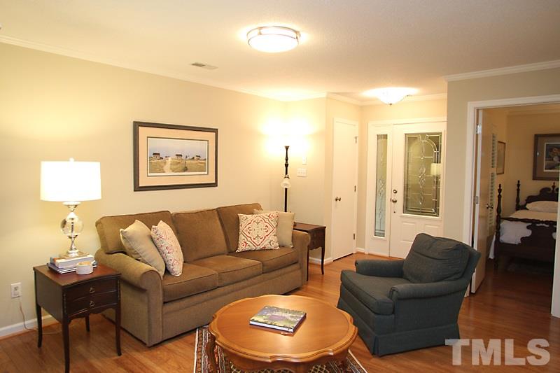 3405 Mill Run Raleigh, NC 27612 - Photo 3 of 12 a living room with furniture and a lamp