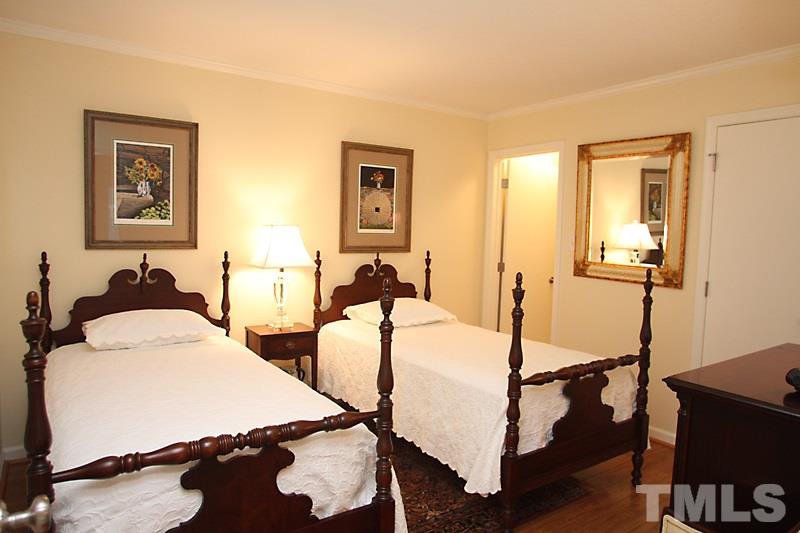 3405 Mill Run Raleigh, NC 27612 - Photo 6 of 12 a bed room with two bed and a night stand