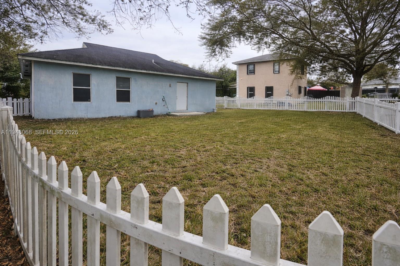 2145 Northwest 68th Terrace Miami, FL 33147 - Photo 12 of 12 a front view of a house with garden