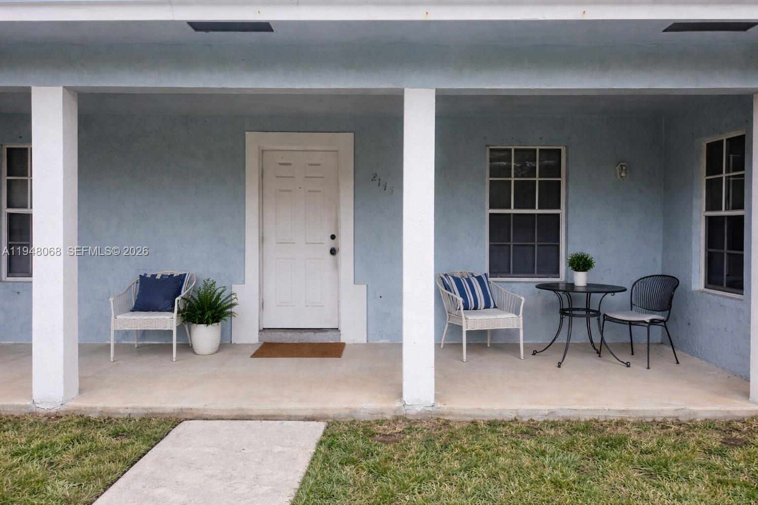 2145 Northwest 68th Terrace Miami, FL 33147 - Photo 2 of 12 a view of a house with backyard and sitting area