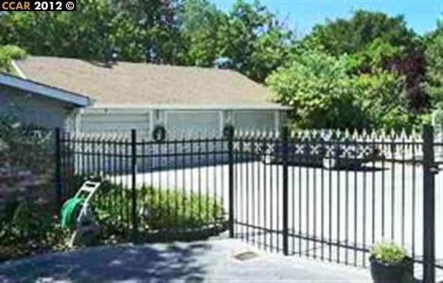 55 Gate Road Walnut Creek, CA 94598 - Photo 2 of 22 a view of a wrought iron fences in front of house