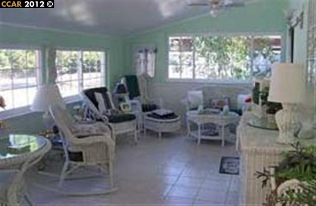 55 Gate Road Walnut Creek, CA 94598 - Photo 15 of 22 a living room with furniture and a large window