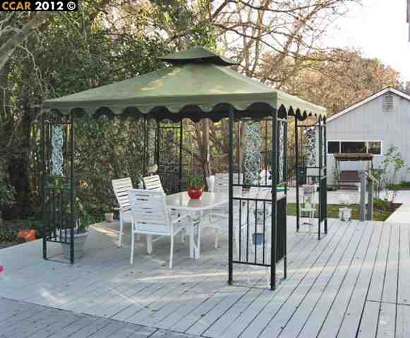 55 Gate Road Walnut Creek, CA 94598 - Photo 18 of 22 a patio with a yard table and chairs