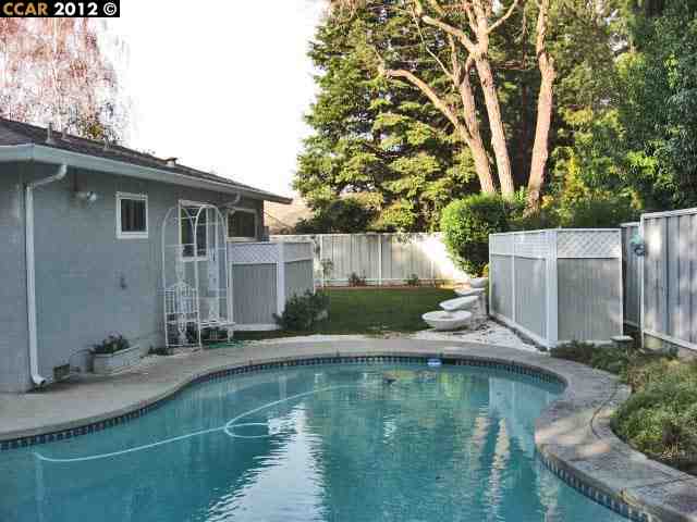 55 Gate Road Walnut Creek, CA 94598 - Photo 20 of 22 a view of a house with pool yard and a large tree