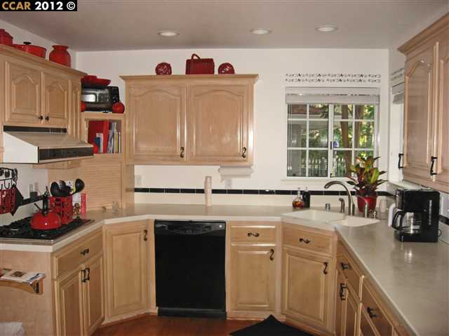55 Gate Road Walnut Creek, CA 94598 - Photo 3 of 22 a kitchen with cabinets appliances a sink and a counter top space