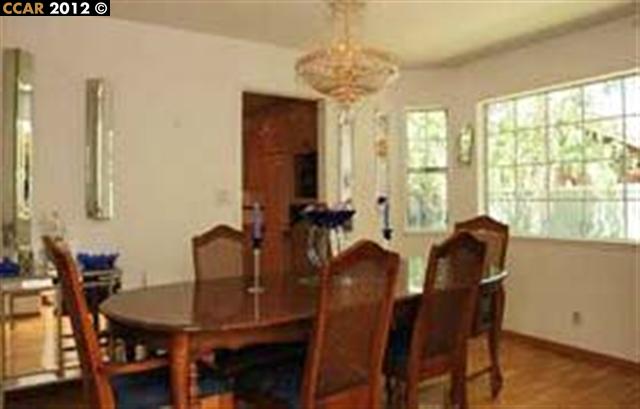 55 Gate Road Walnut Creek, CA 94598 - Photo 7 of 22 a view of a dining room with furniture and windows