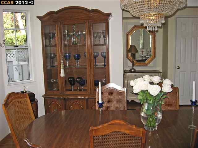 55 Gate Road Walnut Creek, CA 94598 - Photo 8 of 22 a view of a dining room with furniture and chandelier