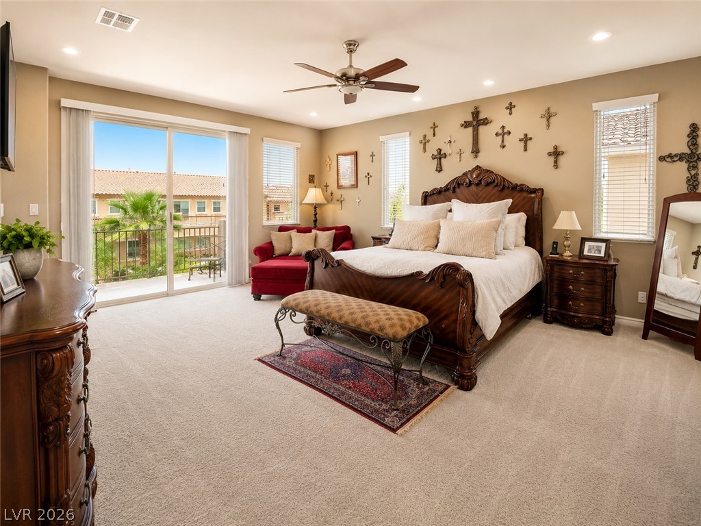 9724 University Ridge Avenue Las Vegas, NV 89149 - Photo 47 of 61 A spacious primary bedroom features a private balcony for morning relaxation.