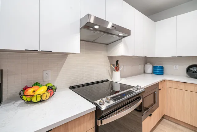 a kitchen with a stove and a microwave