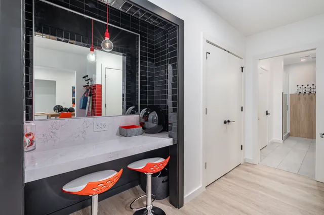 a bathroom with a double vanity sink and a mirror