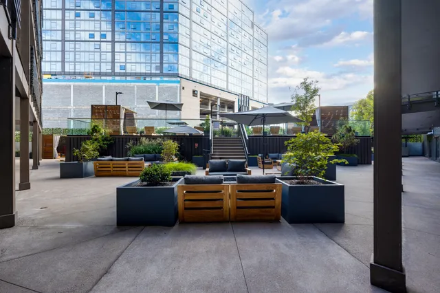 a view of a patio with a table and chairs