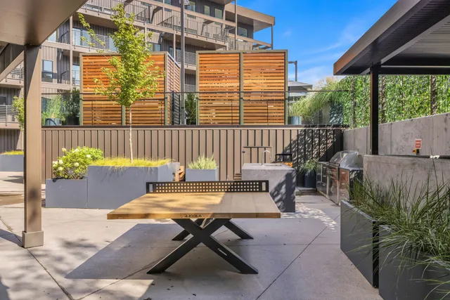 a view of a patio with couches and potted plants