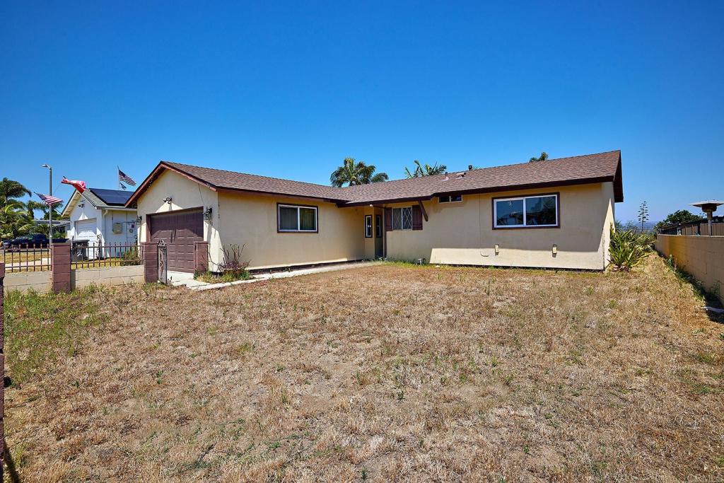 588 Charles Drive Oceanside, CA 92057 - Photo 12 of 17 a front view of a house with a yard