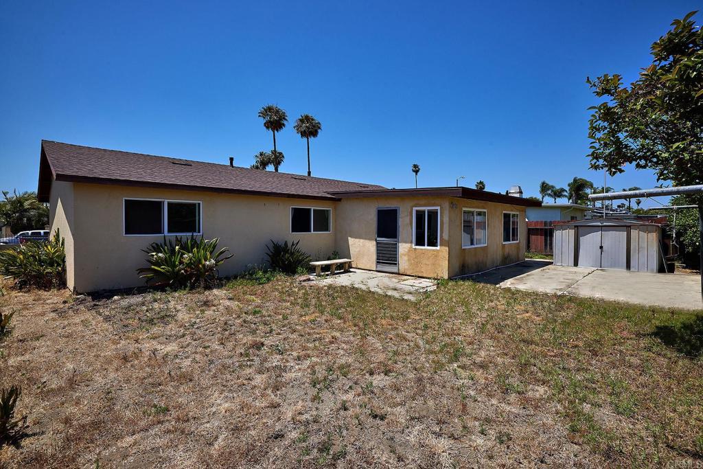 588 Charles Drive Oceanside, CA 92057 - Photo 13 of 17 a front view of a house with a yard