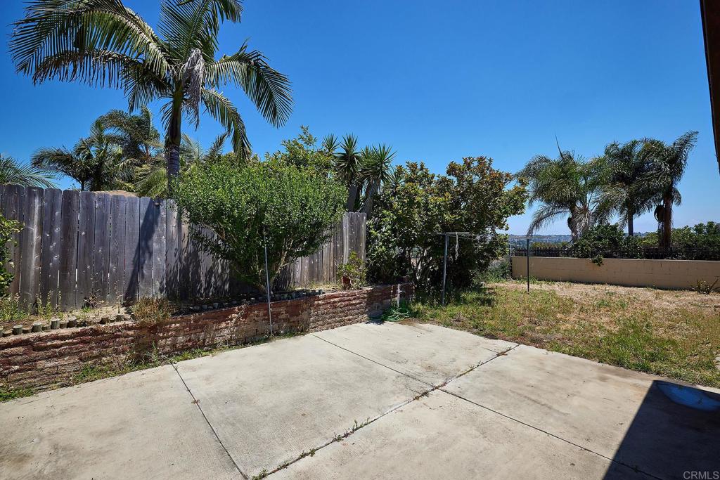 588 Charles Drive Oceanside, CA 92057 - Photo 14 of 17 a backyard of a house with lots of green space