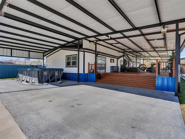 a view of an empty room with wooden walls