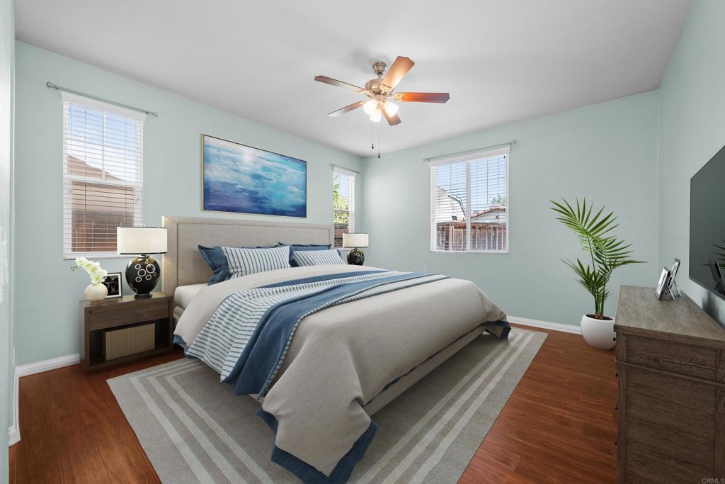 40296 Pasadena Drive Temecula, CA 92591 - Photo 14 of 36 a bedroom with a large bed and a chandelier