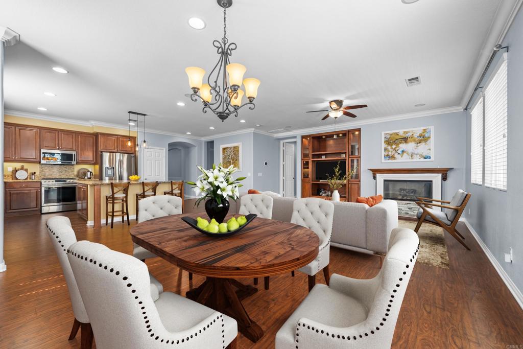 40296 Pasadena Drive Temecula, CA 92591 - Photo 10 of 36 a view of a dining room with furniture a chandelier and wooden floor