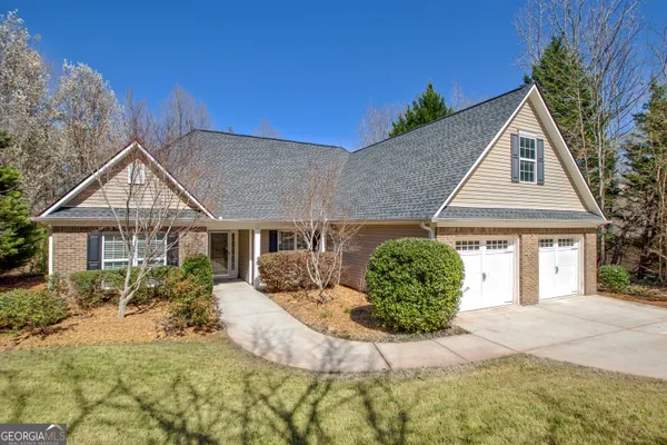 a front view of a house with a yard