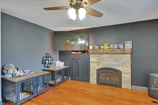 a bed room with furniture and a fireplace