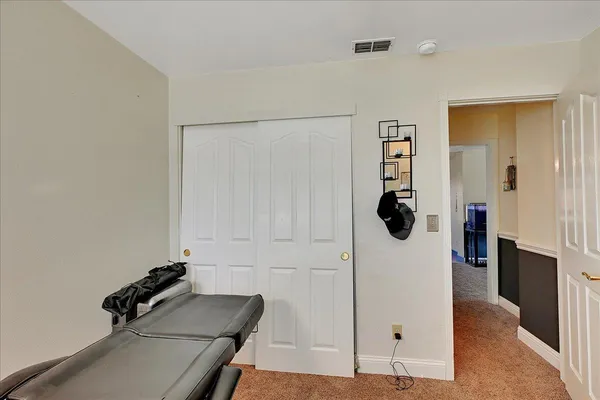 a room with gym equipment and a shower